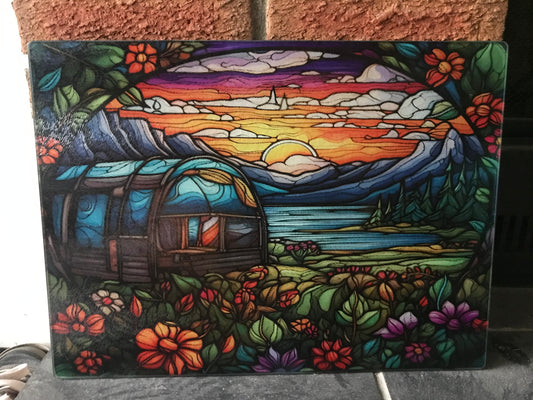 Camper in mountain cutting board